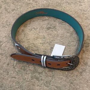 This is a Girl's Catchfly all leather Tan Belt with Tooled Pattern. Size medium